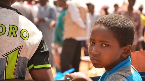 Child at the food distribution in Konio.JPG